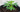 Living soil: dark, crumbly soil in a fabric pot with a healthy young plant